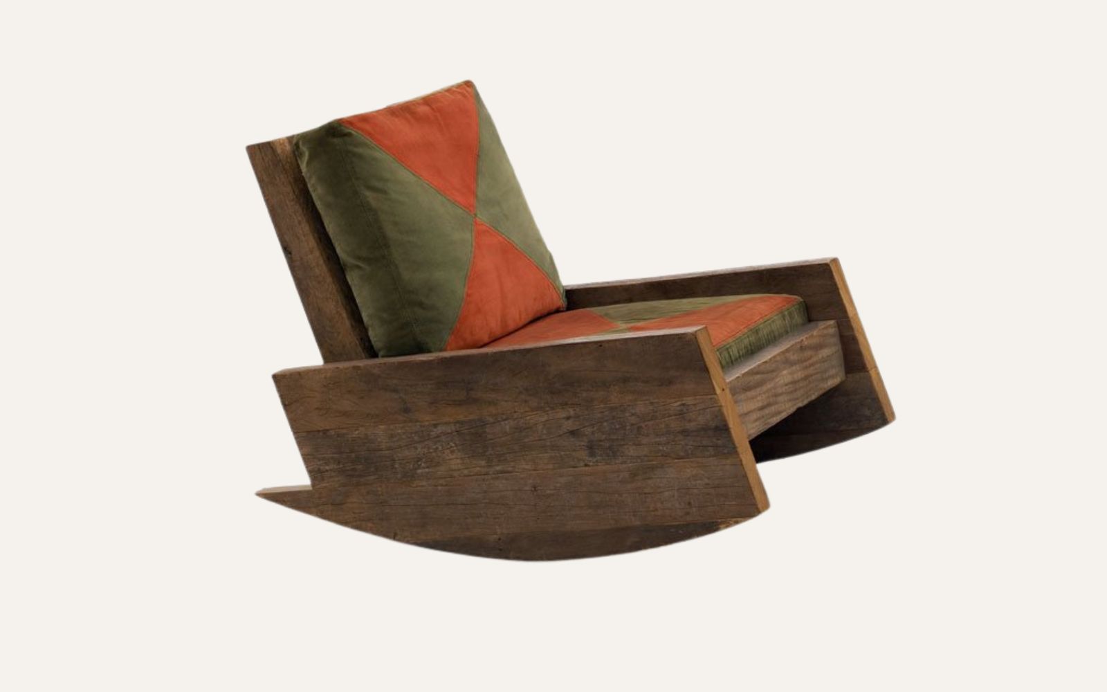 Asturias armchair by Carlos Motta, broad solid-wood form sculpted from reclaimed timber.